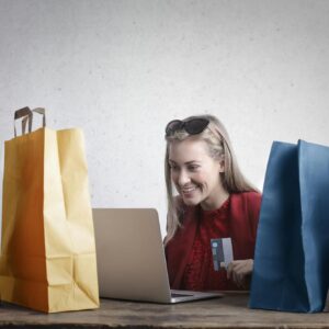 Happy woman shopping online at home